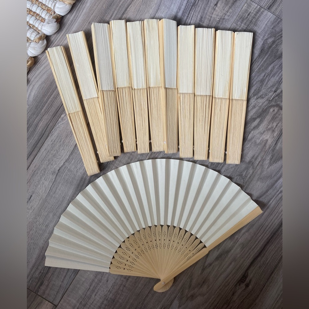 A dozen paper Hand Fans